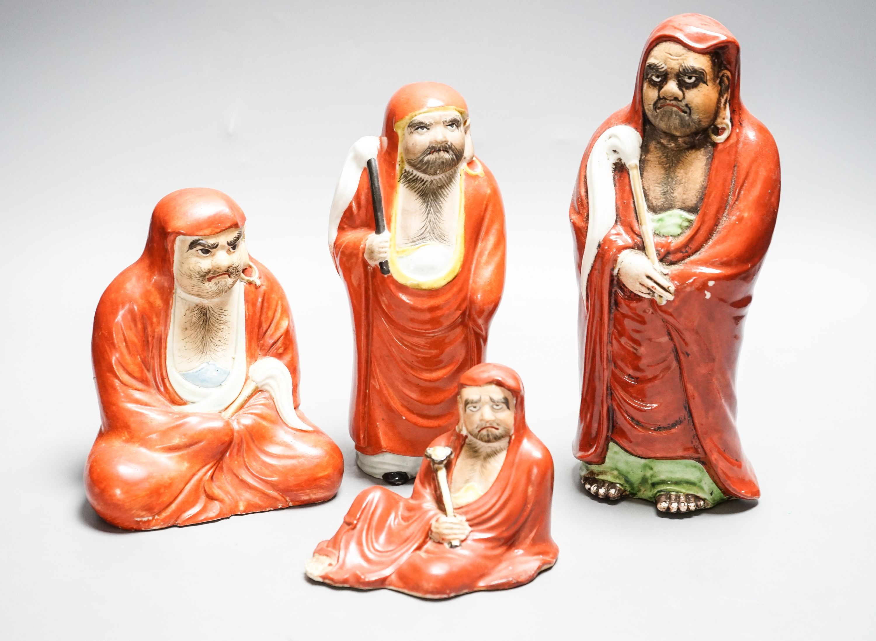 Four Chinese or Japanese porcelain figures of Luohan 25cm